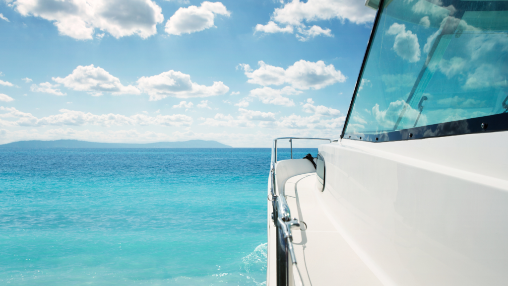 View of a calm blue ocean waters in the Caribbean from the vantage point beside a large ship.